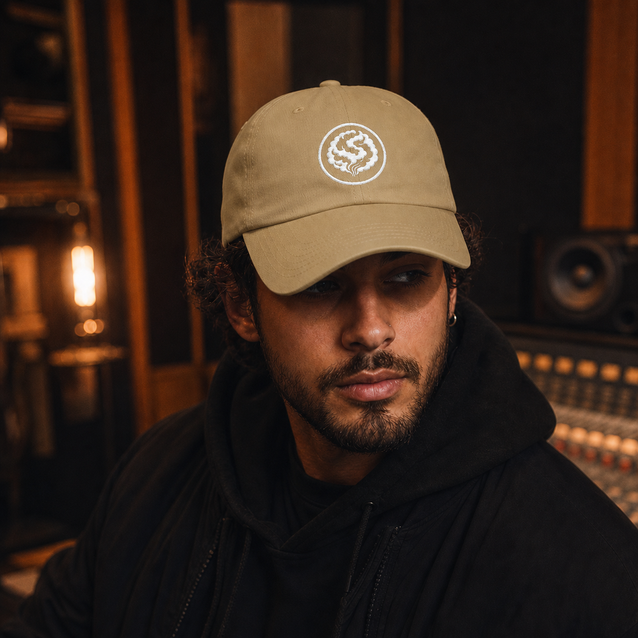 Male model wearing khaki Studio Sessions The Circle dad cap in a recording studio